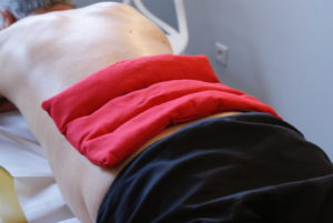 utilisation d'un coussin chauffant sue la région lombaire